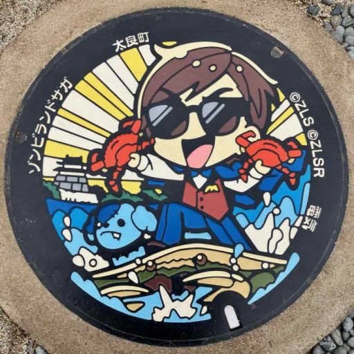 フランシュシュプロデューサー巽幸太郎のマンホール蓋（竹崎ガニ・有明海・竹崎城址）
